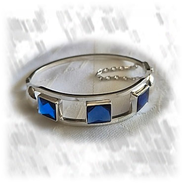 BA00700D-Sterling Silver Synthetic Sapphire Bangle. $700.00 now $490.00 ​