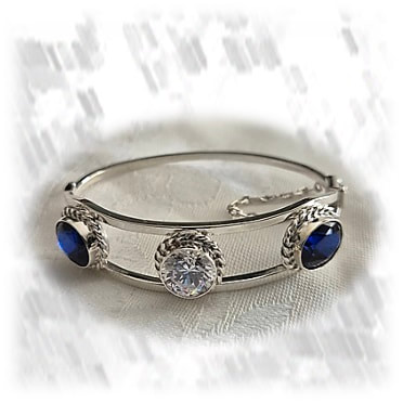 BA00700H-Sterling Silver Cubic Synthetic Sapphire Bangle. $700.00 now $490.00