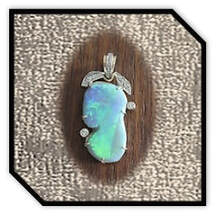 Main page item 18ct yellow gold diamond encrusted & large free-form Mintabie solid opal pendant $18000A