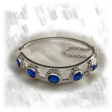 BA00650E-Sterling Silver Synthetic Sapphire Bangle. $650.00