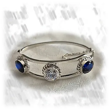 BA00700H-Sterling Silver Cubic Synthetic Sapphire Bangle. $700.00