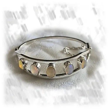 BA02500B-Sterling Silver Opal Bangle. $2500.00