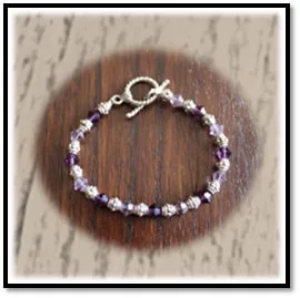 Main page item 9ct yellow gold & oval amethyst ladies ring $600A links to item silver purple crystal & silver bead bracelet $180E
