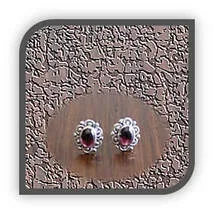 Main page item fancy edge silver & oval cabochon garnet studs $150B