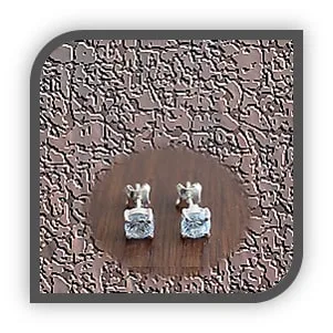 ES00150I-Sterling Silver Blue Zircon Studs. $150.00