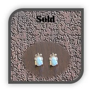 ES00600A-9ct Yellow Gold Opal Studs. $600.00