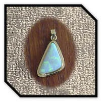 Main page item 9ct yellow gold & free-form solid opal pendant $1000D